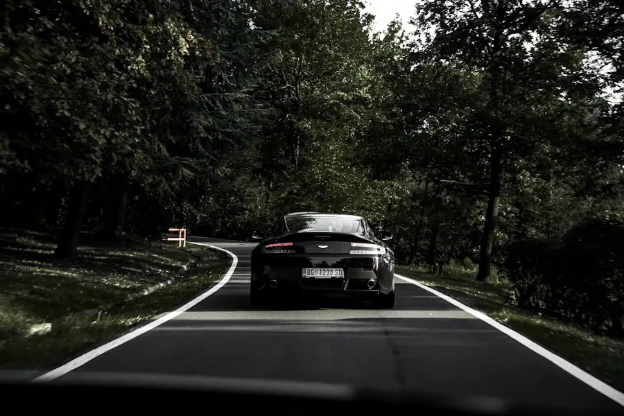 Black coupé on the road — Aston Martin care in Trinidad