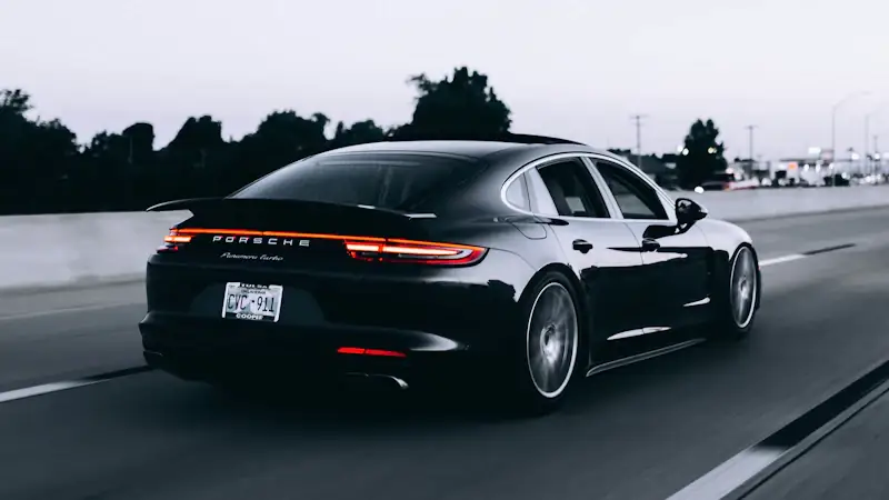 European sports car at dusk — serving Port of Spain