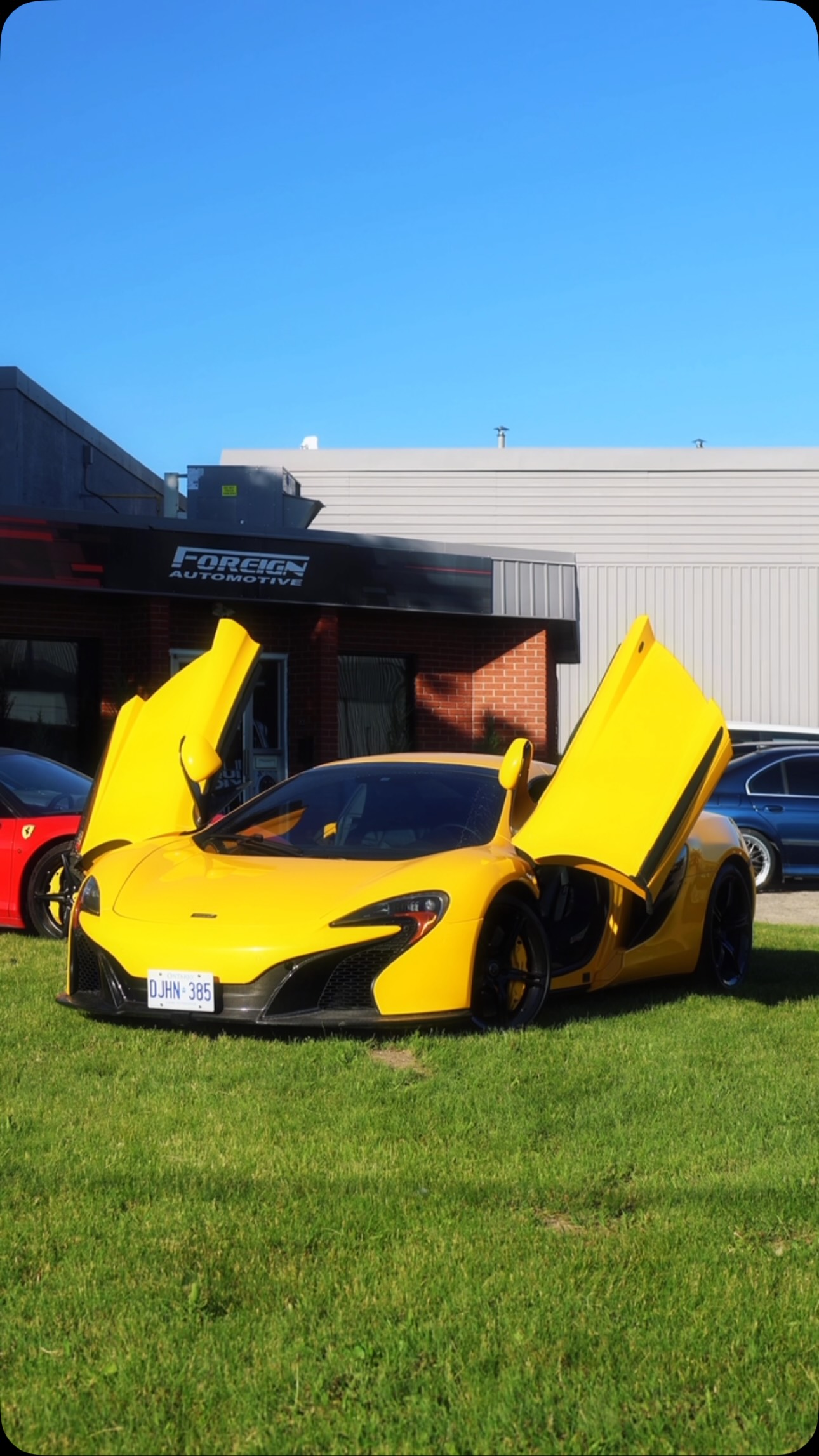 Yellow McLaren outside Foreign Automotive's Canadian workshop