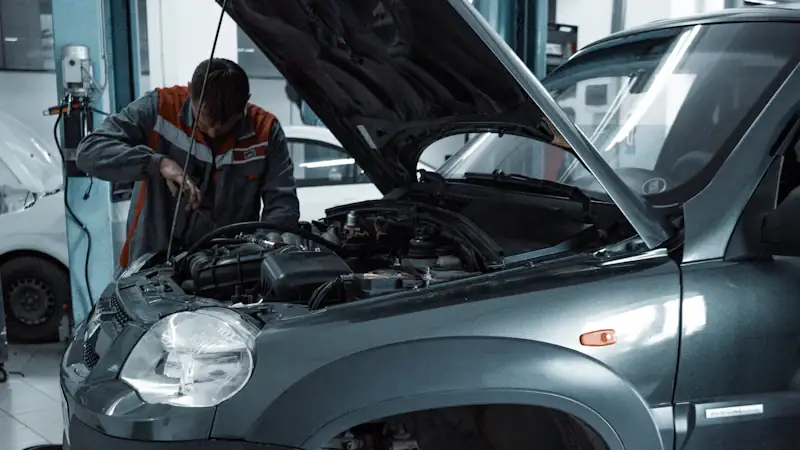 Vehicle in a service bay — dealer-level diagnostics