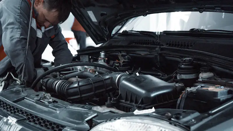 Technician inspecting a vehicle — pre-purchase inspections
